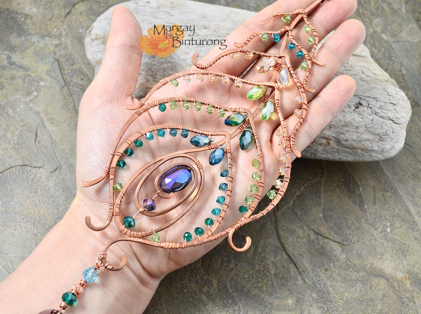 Peacock feather gemstone suncatcher fills the room with sparkles from crystal prism beads