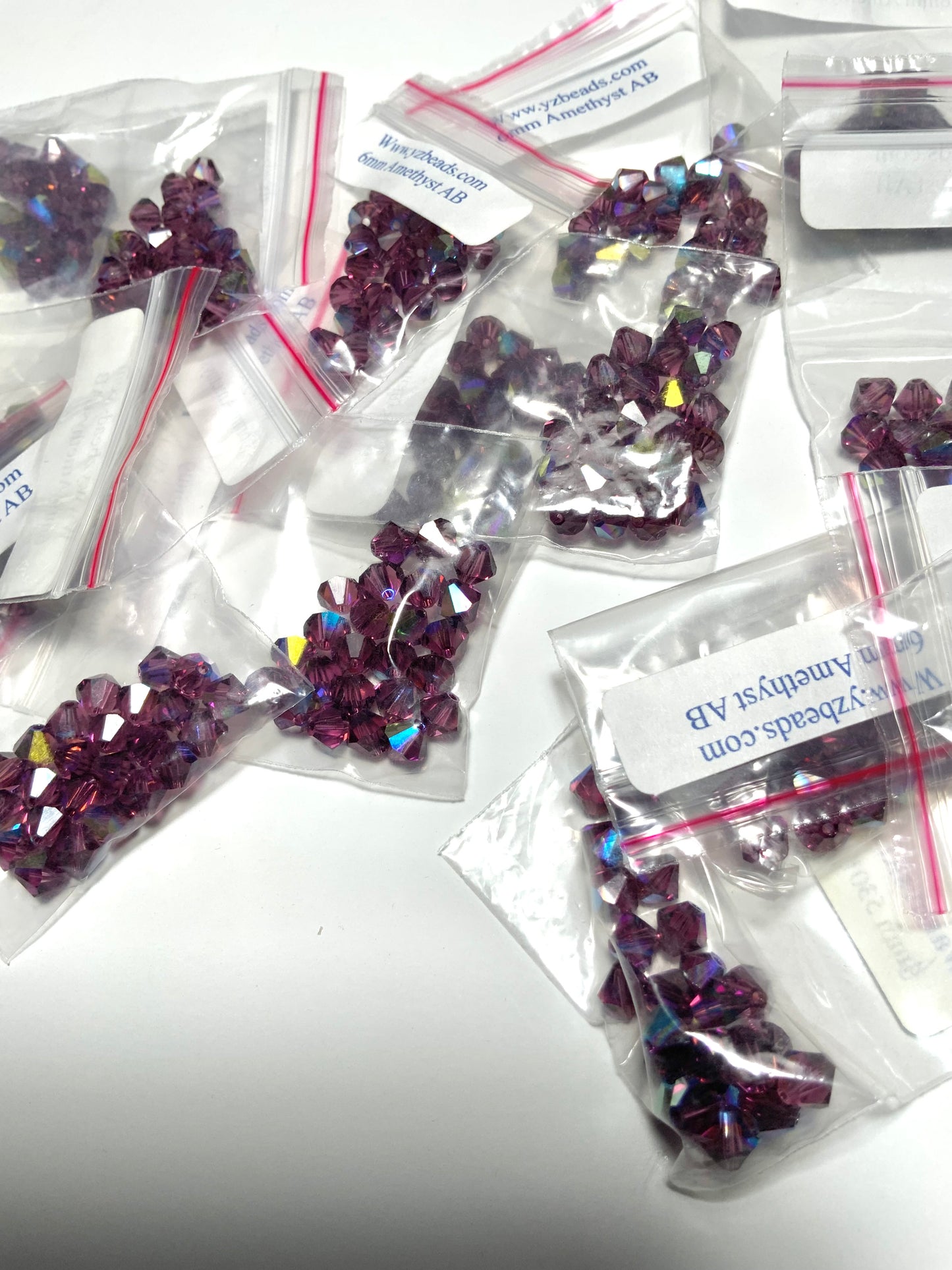 Surplus Swar*vski Destash—  8 Bags (192 pcs)— 5301 6mm Bicone Amethyst AB