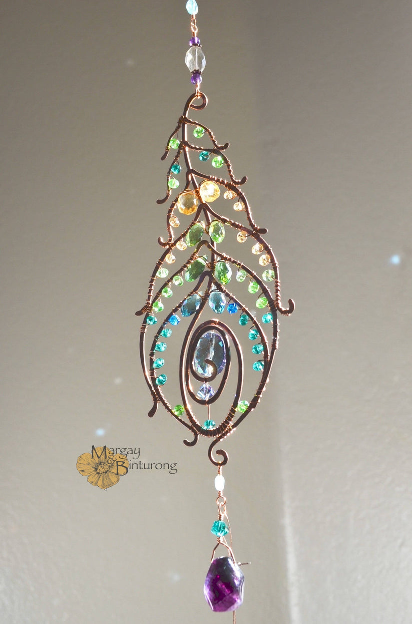 Peacock feather gemstone suncatcher fills the room with sparkles from ...